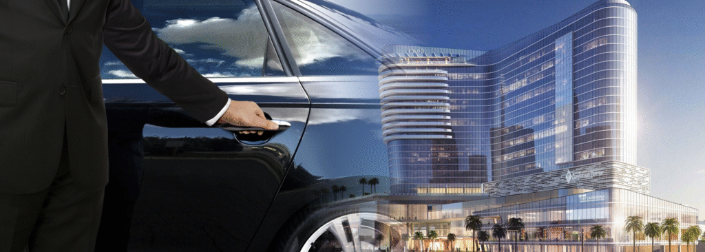 Chauffeur opening car door in front of Omni Fort Lauderdale hotel.